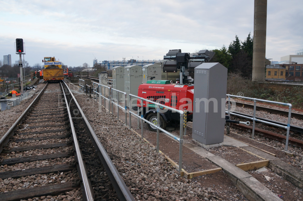 Close-up of Interclamp key clamp fittings forming a secure modular balustrade safety post system on a railway, ensuring the safety of workers in hazardous areas.